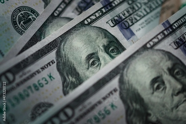 Obraz Several one hundred dolar bills. Extreme macro close up, focusing on the eyes of Benjamin Franklin.