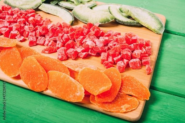 Obraz Mixture of dried fruit  on a colorful  wooden background.