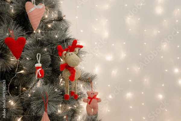 Fototapeta Christmas tree decorated with handmade toys