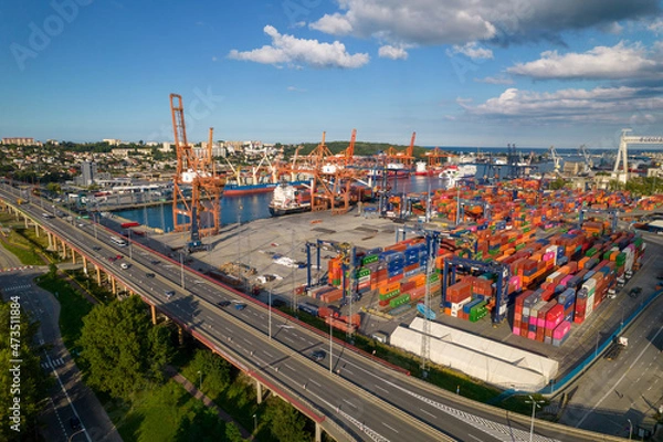 Fototapeta Port of Gdynia. Seaport, containers, container ships and sea transport from the bird's eye view on a sunny day.