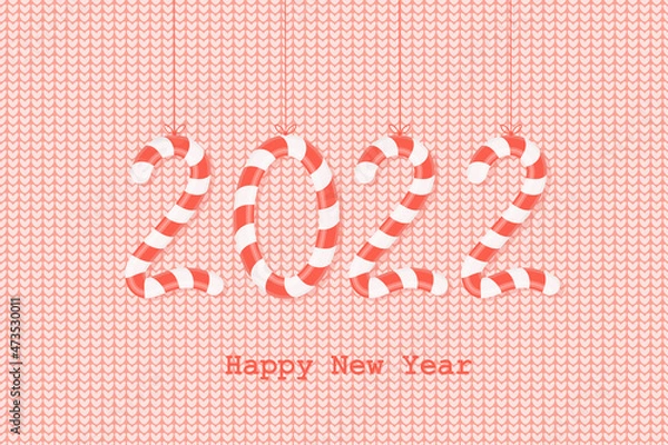 Fototapeta Happy New Year 2022! The numbers 2022 are in the form of sweet candies on a red knitted background. Christmas greeting card. Vector