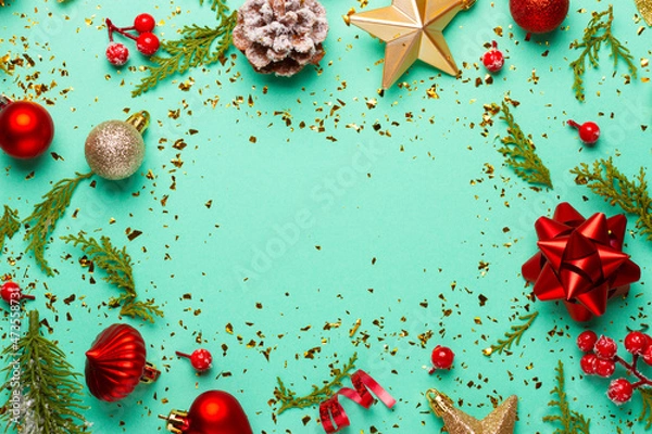 Obraz Christmas composition with decorations and ornaments on a mint background