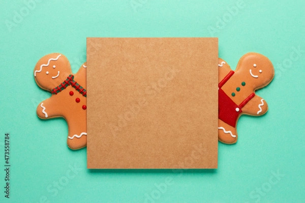 Fototapeta Christmas composition with decorations and cookies on a mint background with space for text