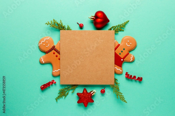 Fototapeta Christmas composition with decorations and cookies on a mint background with space for text