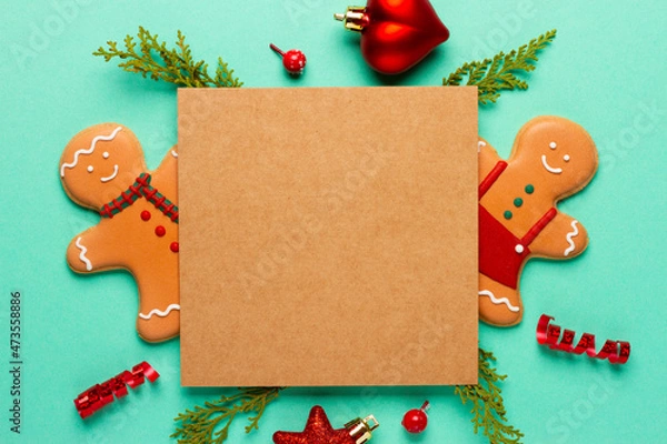 Fototapeta Christmas composition with decorations and cookies on a mint background with space for text