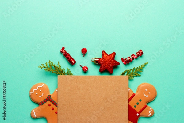 Fototapeta Christmas composition with decorations and cookies on a mint background with space for text