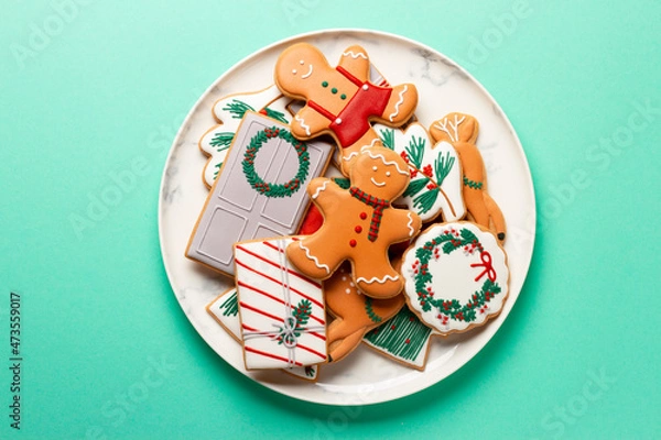 Fototapeta Christmas composition with decorations and cookies on a mint background