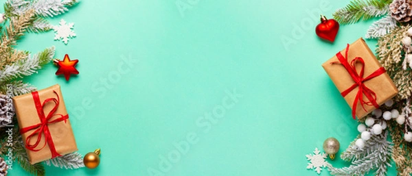 Fototapeta Christmas composition with decorations and ornaments on a mint background