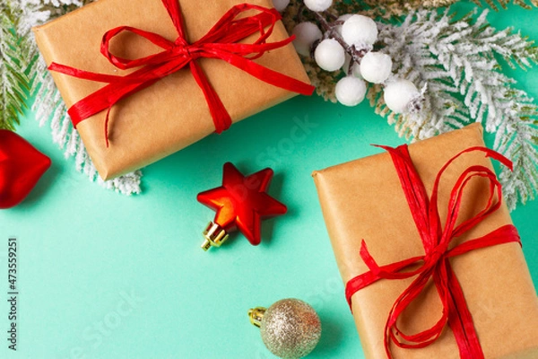 Fototapeta Christmas composition with decorations and ornaments on a mint background