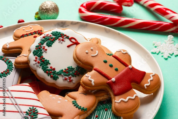 Fototapeta Christmas composition with decorations and cookies on a mint background