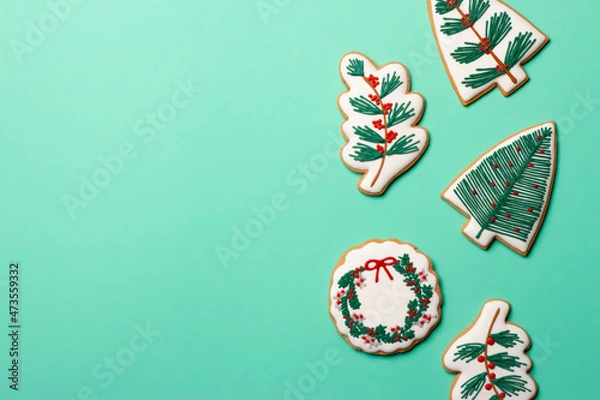 Fototapeta Christmas composition with decorations and cookies on a mint background