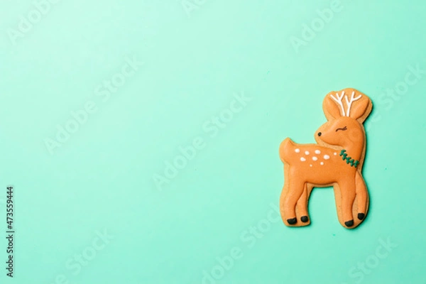 Fototapeta Christmas composition with decorations and cookies on a mint background
