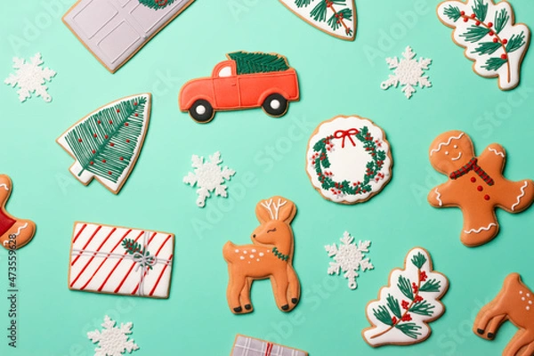 Fototapeta Christmas composition with decorations and cookies on a mint background