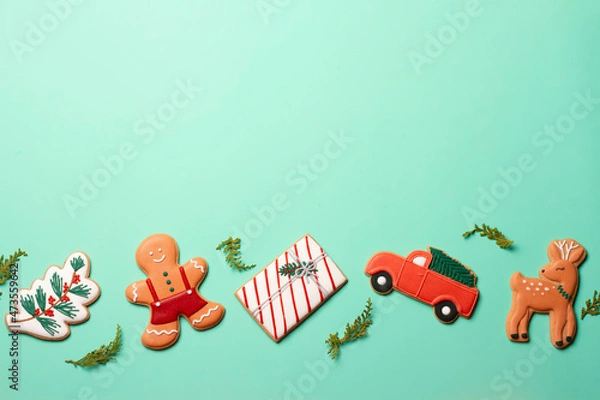 Fototapeta Christmas composition with decorations and cookies on a mint background