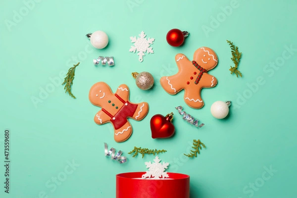 Fototapeta Christmas composition with decorations and cookies on a mint background