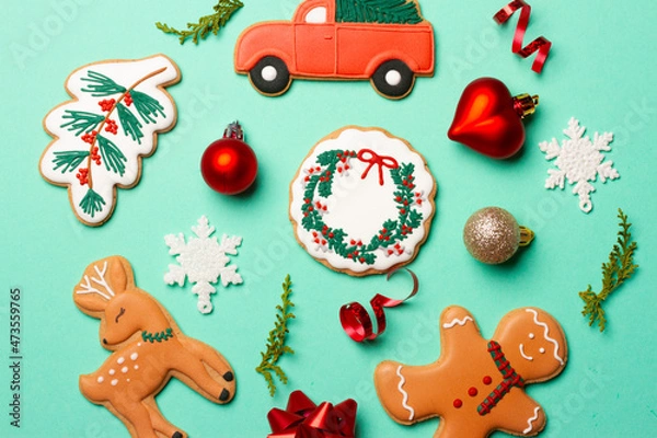 Fototapeta Christmas composition with decorations and cookies on a mint background