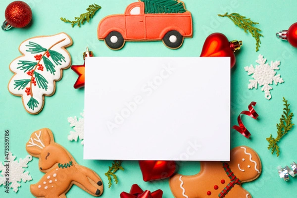 Fototapeta Christmas composition with decorations and cookies on a mint background