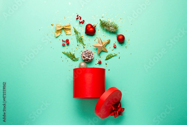 Fototapeta Christmas composition with decorations and ornaments on a mint background