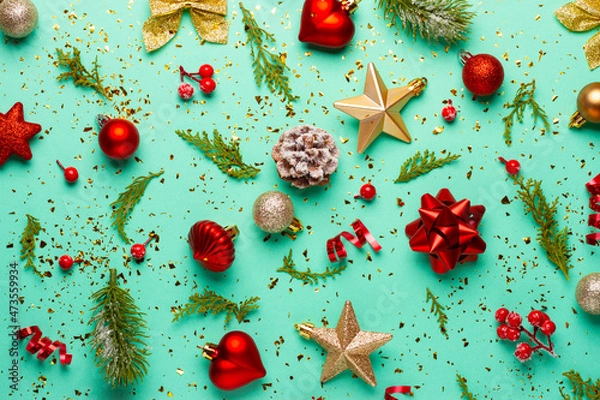 Fototapeta Christmas composition with decorations and ornaments on a mint background