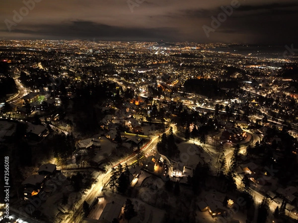 Fototapeta night city photo of oslo, norway a winter night. shot with a drone high up in the sky