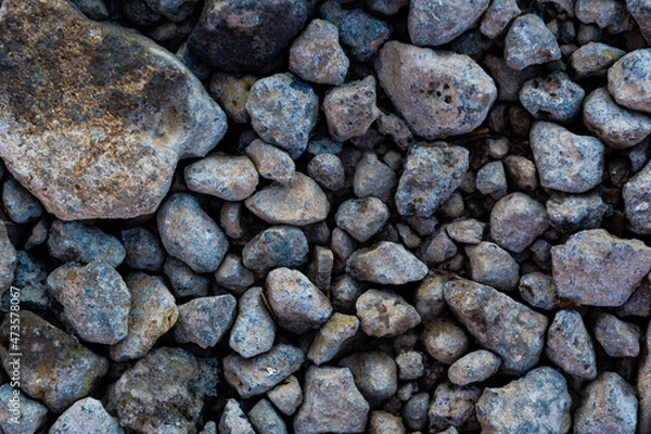 Obraz The background is made of textured rubble, gray. The texture of pieces of gray blast furnace slag. Pieces of crushed stone of different fractions.