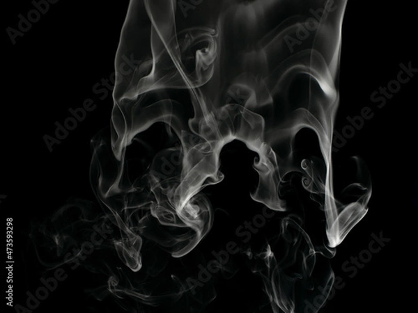 Fototapeta Chaotic mixing smoke creates abstract patterns on a black background