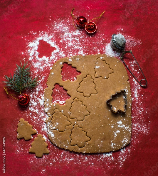 Fototapeta Christmas cookies on red background, cocoa, christmas tree and christmas 
 toys. Trend photo in two planes