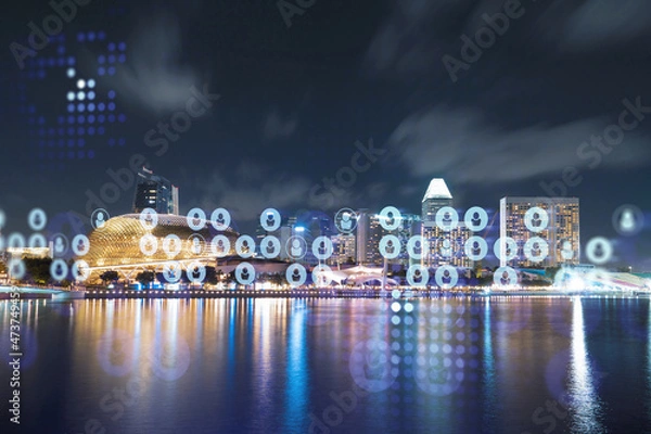 Fototapeta Glowing Social media icons on night panoramic city view of Singapore, Asia. The concept of networking and establishing new connections between people in businesses. Double exposure.