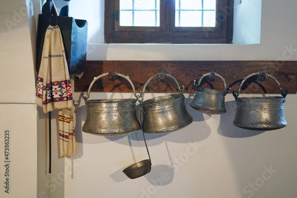 Obraz Old-fashioned wall in the kitchen with metal utensils