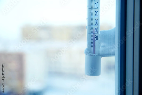 Fototapeta Classic mercury thermometer for measuring ambient temperature, hanging outside the window, with readings minus 30 degrees Celsius.