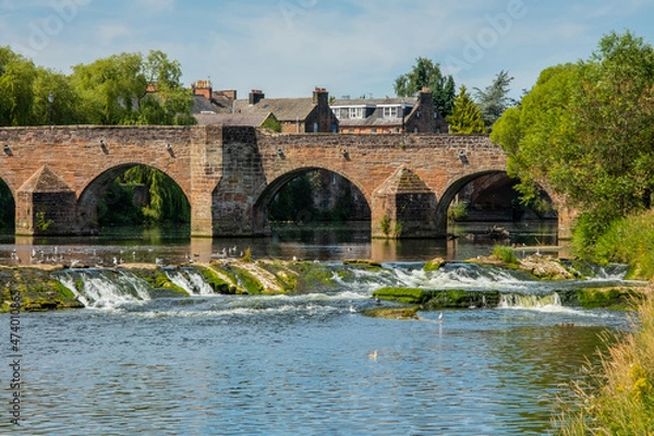 Fototapeta The Devorgilla Bridge, Cauld and River Nith in the centre of Dumfries