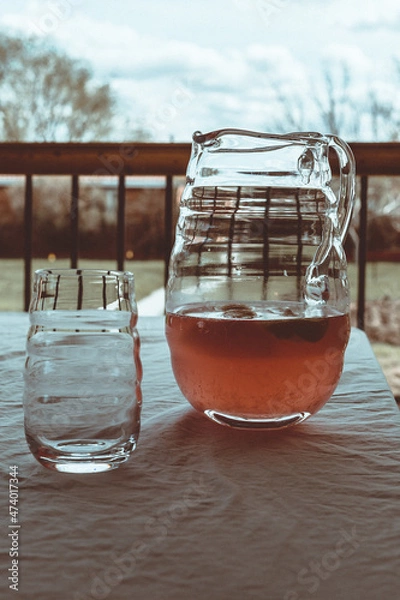 Fototapeta Close up of Pink lemonade in pitcher on table