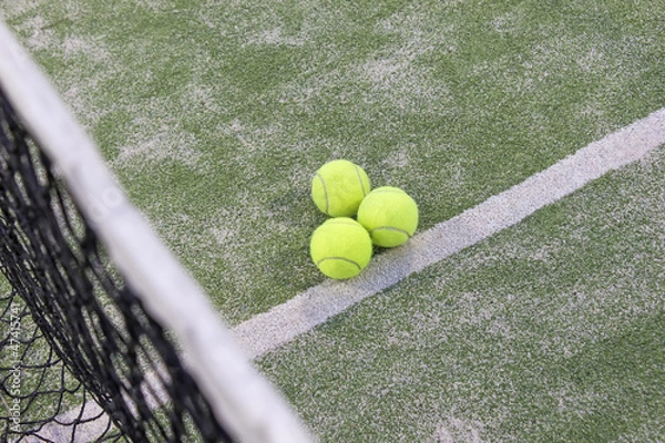 Obraz Tennis or paddle balls on synthetic grass of paddle court
