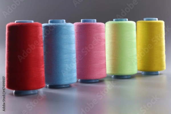 Obraz Fabric threads of different colors on gray background
