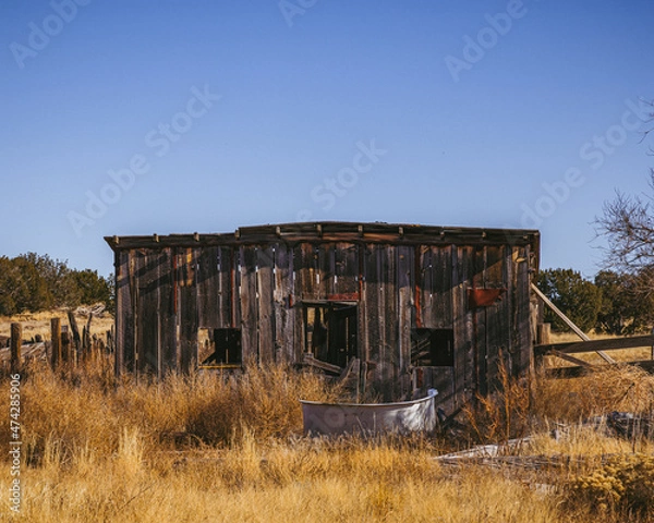 Fototapeta Old abandoned barn that's falling apart