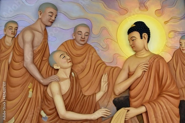 Fototapeta A wall mural depicting Buddha with long earlobes and Buddhist monks with shaves heads and orange robes