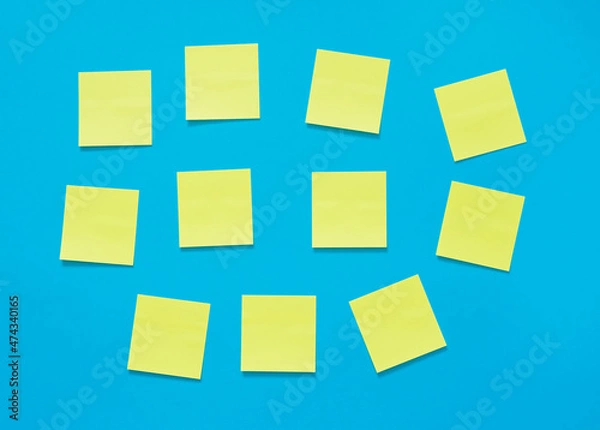 Fototapeta yellow sticky notes on a blue background