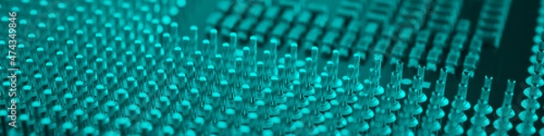 Fototapeta Computer processor close-up. Turquoise tinted banner. Information technology teal headline. A pattern of contacts and semiconductors of a PC microprocessor. Macro