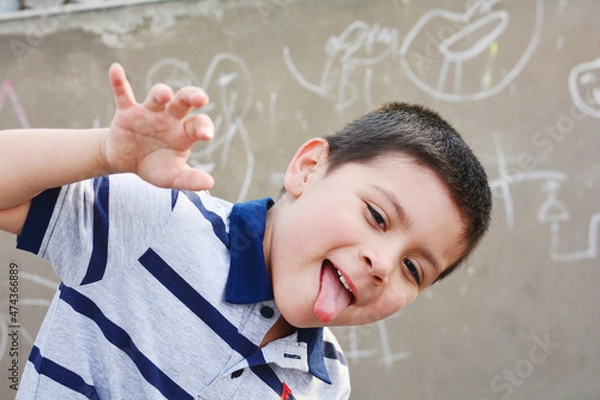 Obraz Funny little latin boy outside.