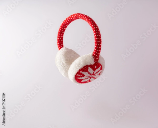 Fototapeta 
Red ear warmers with white snowflakes. New Year's concept.Copy paste