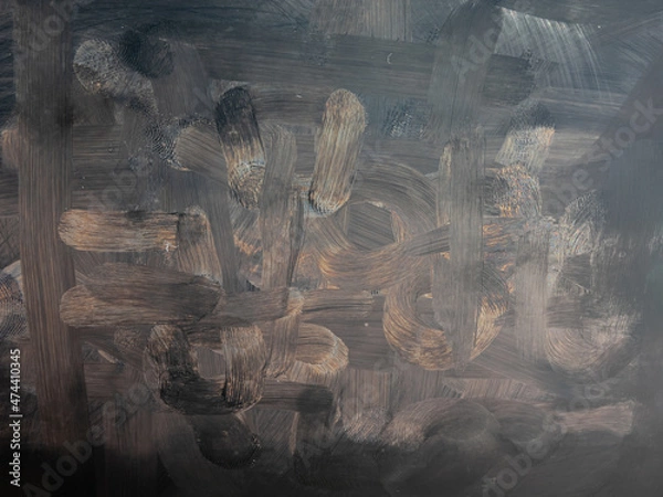 Fototapeta Dirty tablet. Fingerprints form drawings made with dust, moisture and grease marked with fingers on the touchscreen tablet or smartphone screen. Close up.