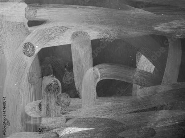 Fototapeta Dirty tablet. Fingerprints form drawings made with dust, moisture and grease marked with fingers on the touchscreen tablet or smartphone screen. Close up.