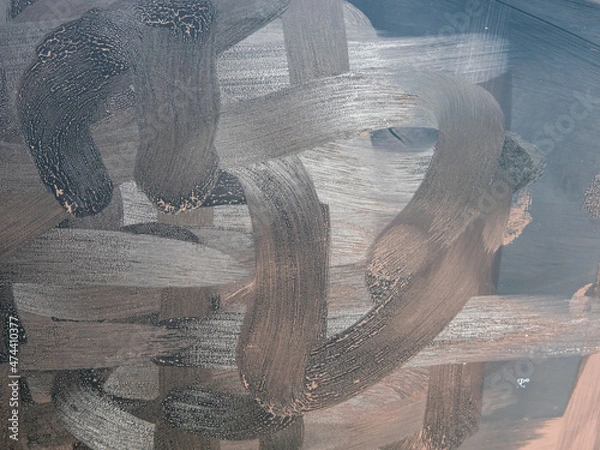 Fototapeta Dirty tablet. Fingerprints form drawings made with dust, moisture and grease marked with fingers on the touchscreen tablet or smartphone screen. Close up.