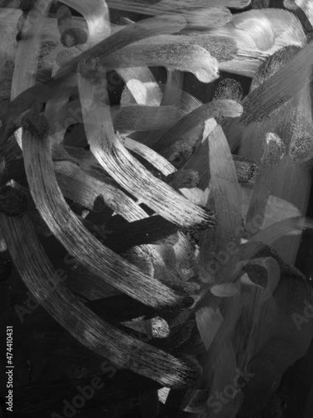 Fototapeta Dirty tablet. Fingerprints form drawings made with dust, moisture and grease marked with fingers on the touchscreen tablet or smartphone screen. Close up.