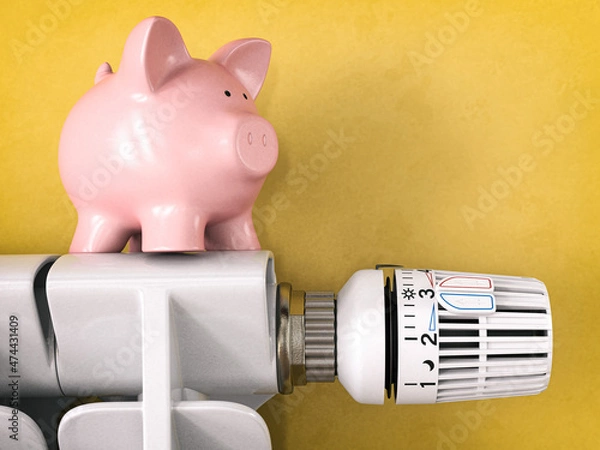 Obraz Piggy bank on radiator with radiator thermostat valve. Energy consumption saving concept.