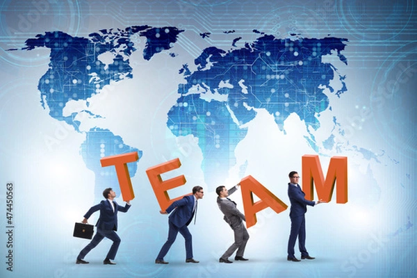 Fototapeta Teamwork concept with people carrying team letters