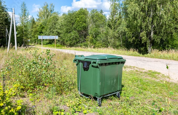 Obraz Green plastic garbage container at the outdoors
