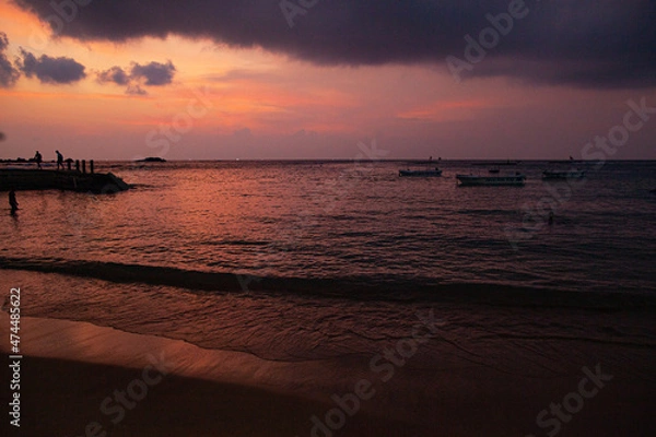 Fototapeta Beach by the ocean with yellow sand in the tropics.