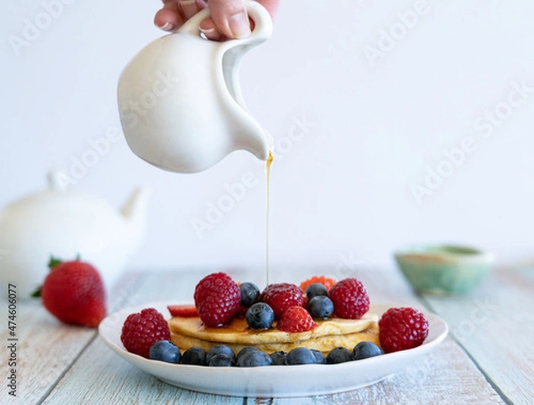 Fototapeta pancakes with maple syrup pour 