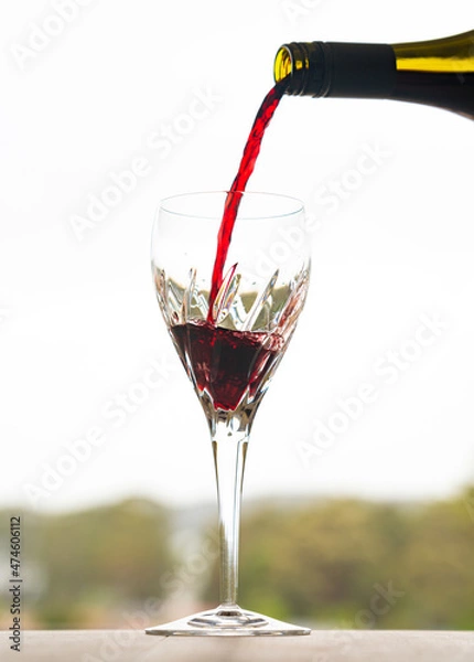 Fototapeta wine pour with sky behind